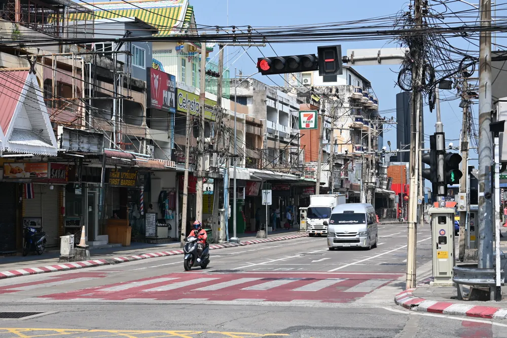 Motorcycles at a Thai city intersection, typical daily commuting scene