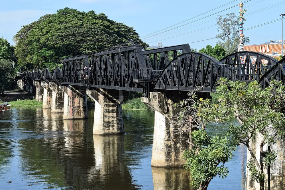 The famous iron bridge spanning the River Kwai in Kanchanaburi — a World War II landmark