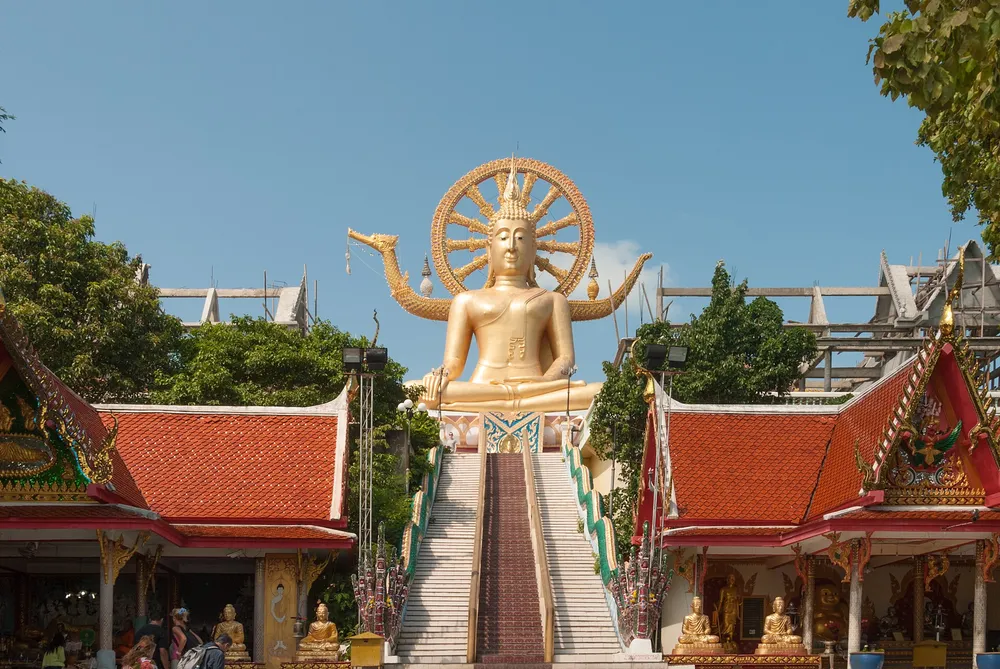 The golden Big Buddha statue at Wat Phra Yai Koh Samui, 12 meters tall on a hilltop