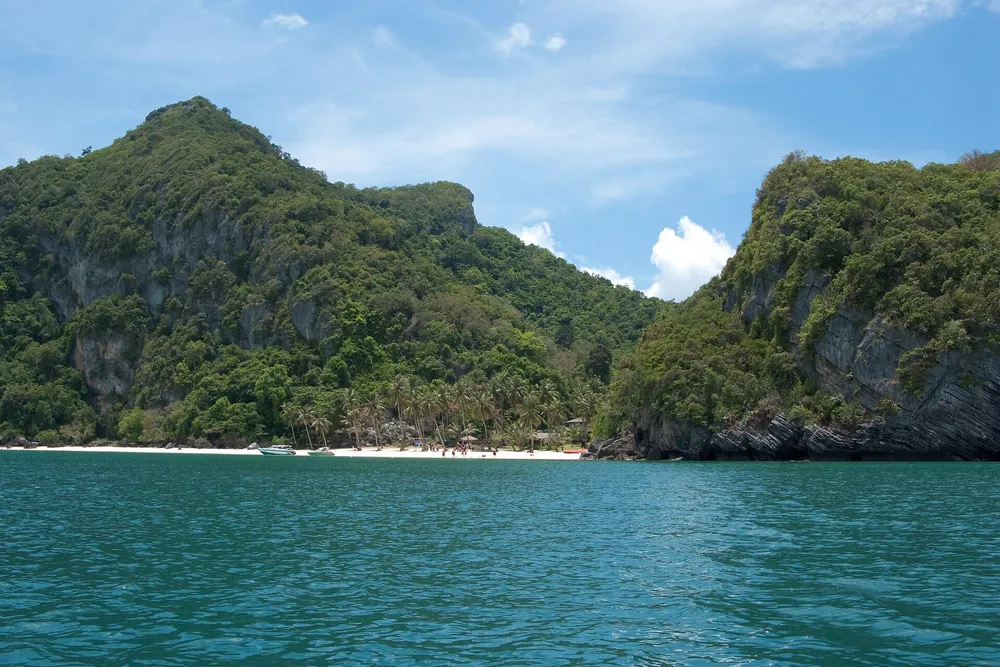Ang Thong National Marine Park — limestone cliffs and white sand beach surrounded by turquoise Gulf of Thailand water