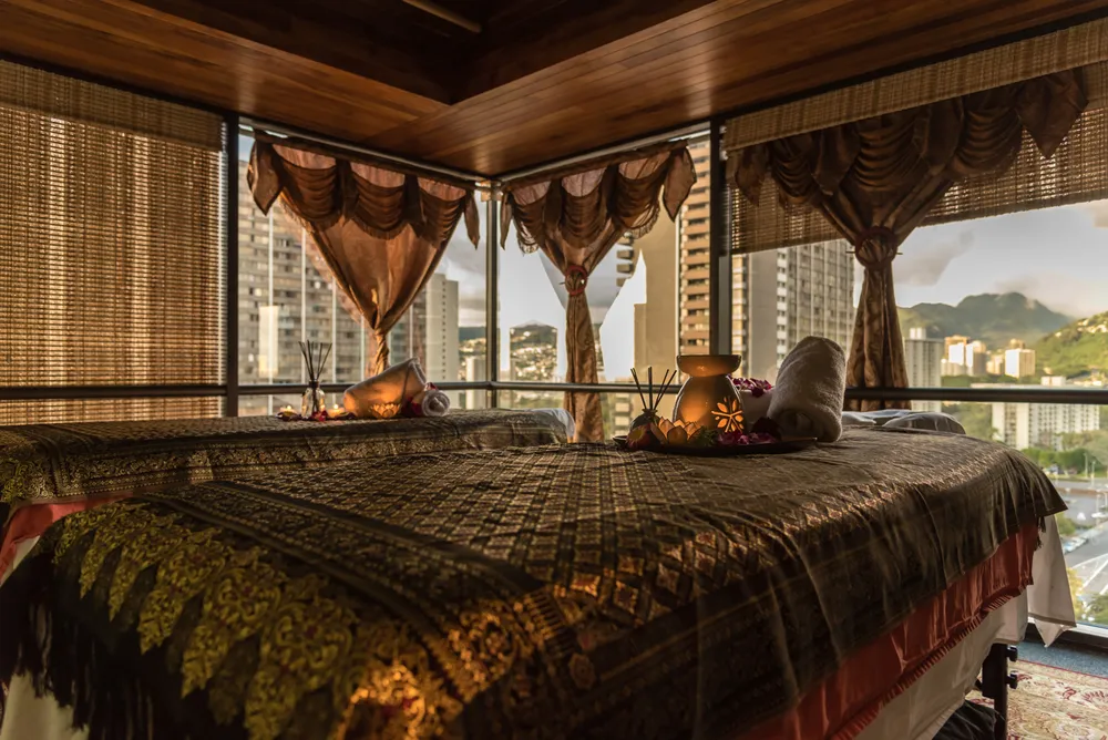 Thai-style spa room with massage beds in a relaxing setting