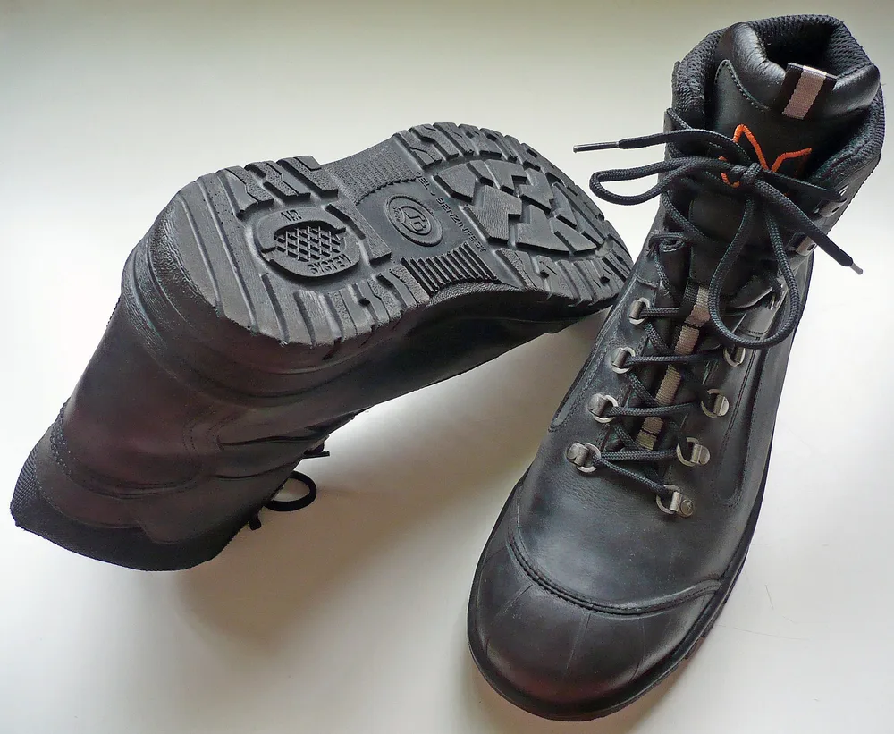 Lace-up steel-toe safety boots, an example of S3-rated safety footwear