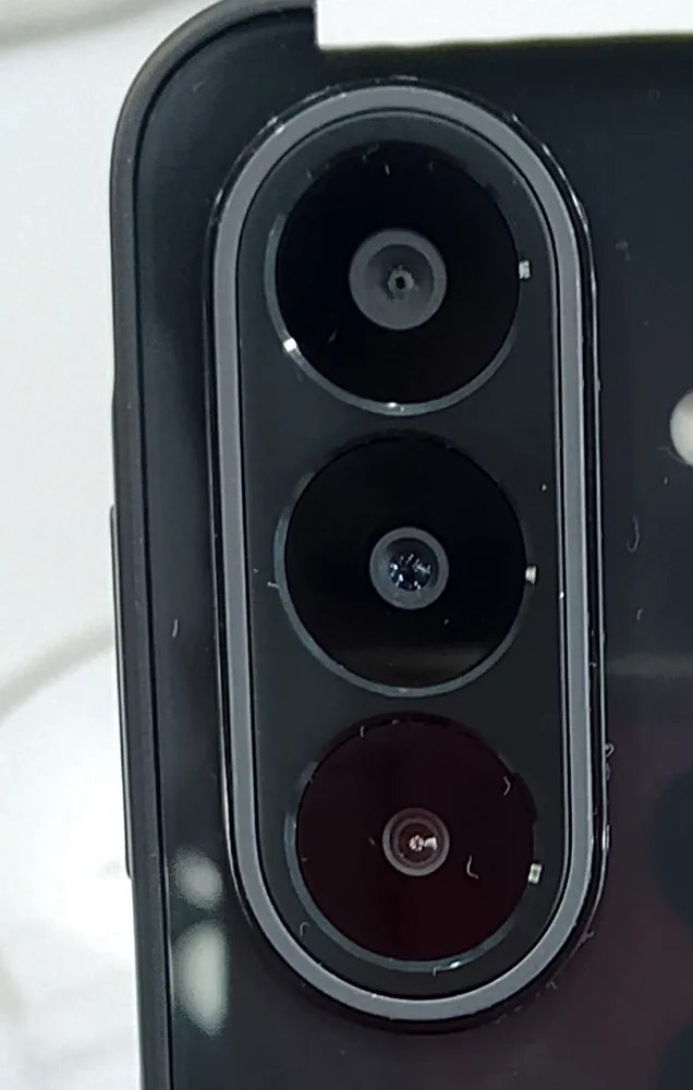Close-up macro shot of the Samsung Galaxy A27 5G's triple rear camera module, showing the main, ultrawide, and macro lenses