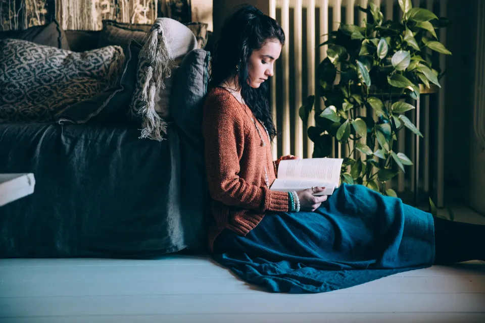Swap pre-bed scrolling for a paper book under dim light