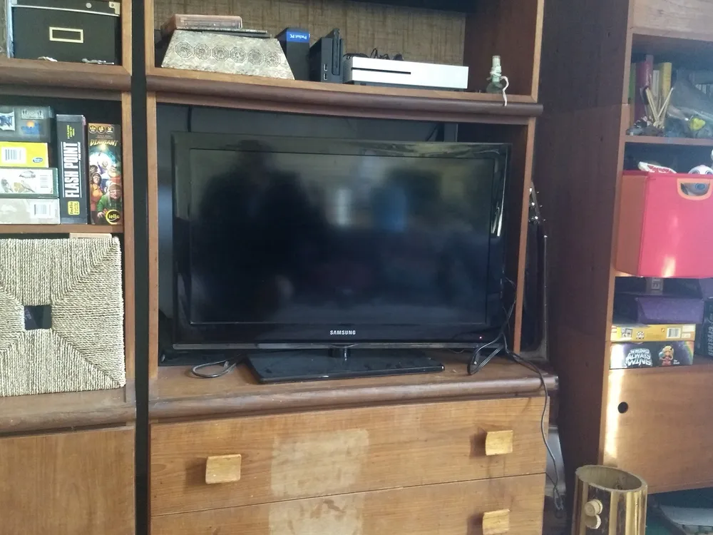 Samsung flat-screen TV in a home living room — soundbars are designed to upgrade exactly this home setup