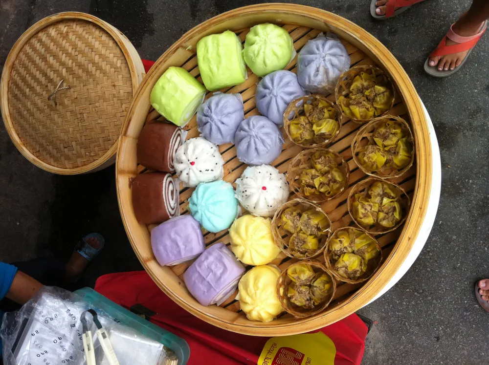 Colorful jay steamed buns and dumplings sold at a Phuket festival market