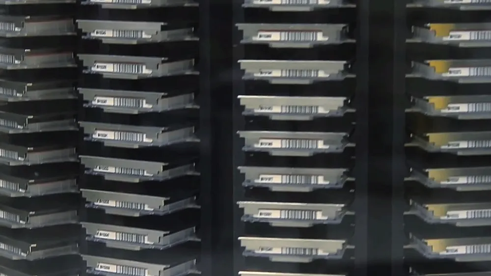 Illustration: server racks and digital storage infrastructure — the digital backbone of modern manufacturing