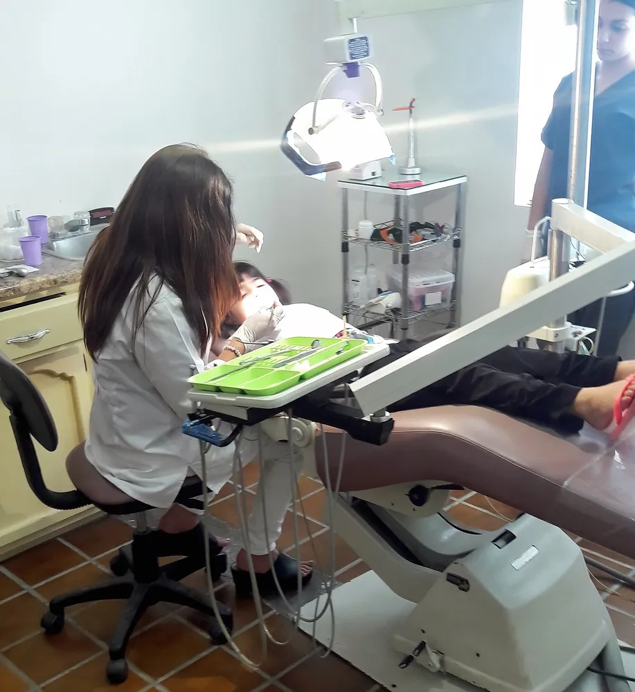 A child receiving dental treatment at a clinic