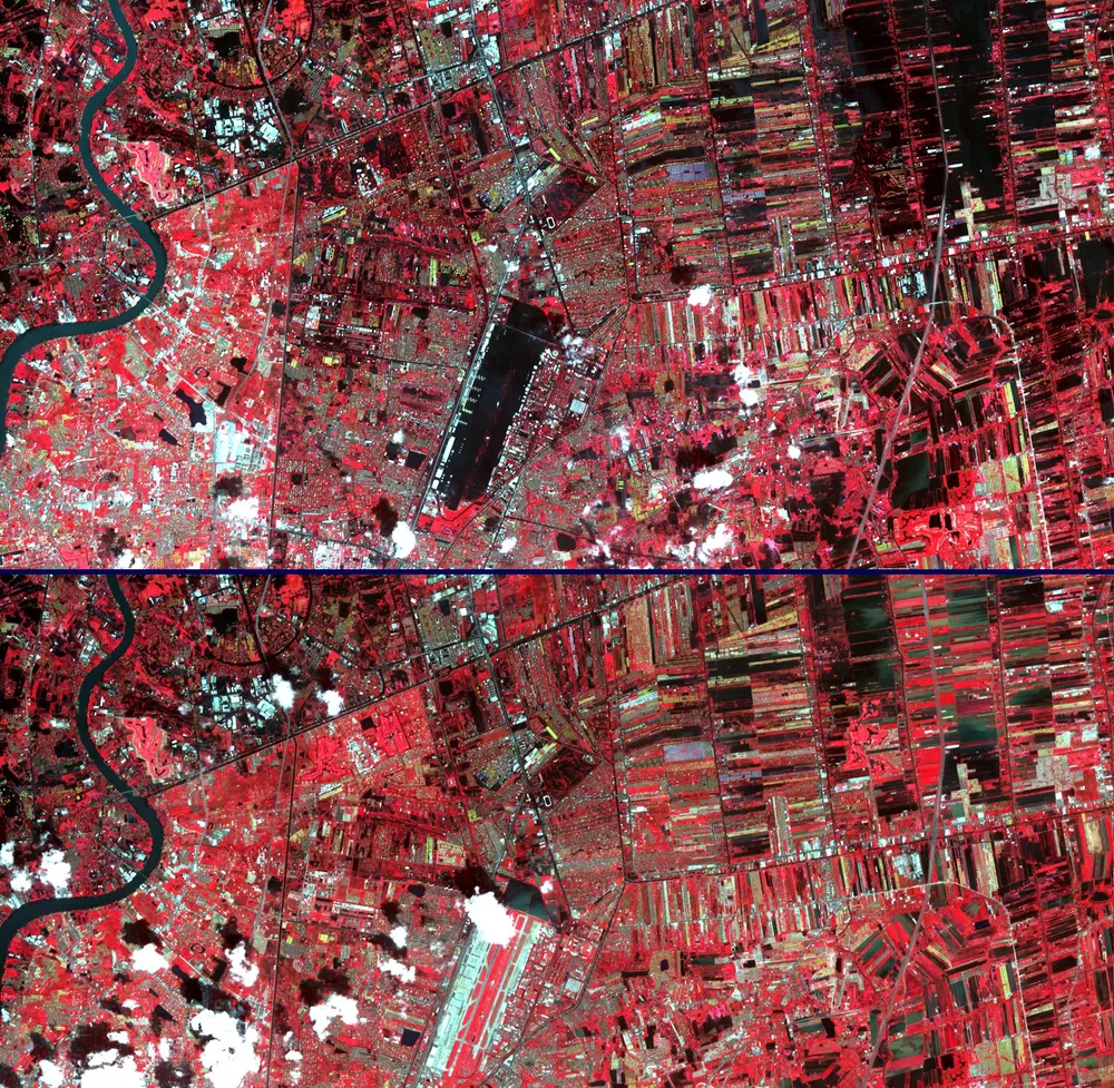 False-colour infrared satellite image showing the extent of flooding across Bangkok and surrounding provinces — blue areas indicate standing floodwater, red areas show intact vegetation