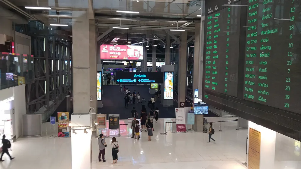 Passengers walking through the Suvarnabhumi Airport terminal