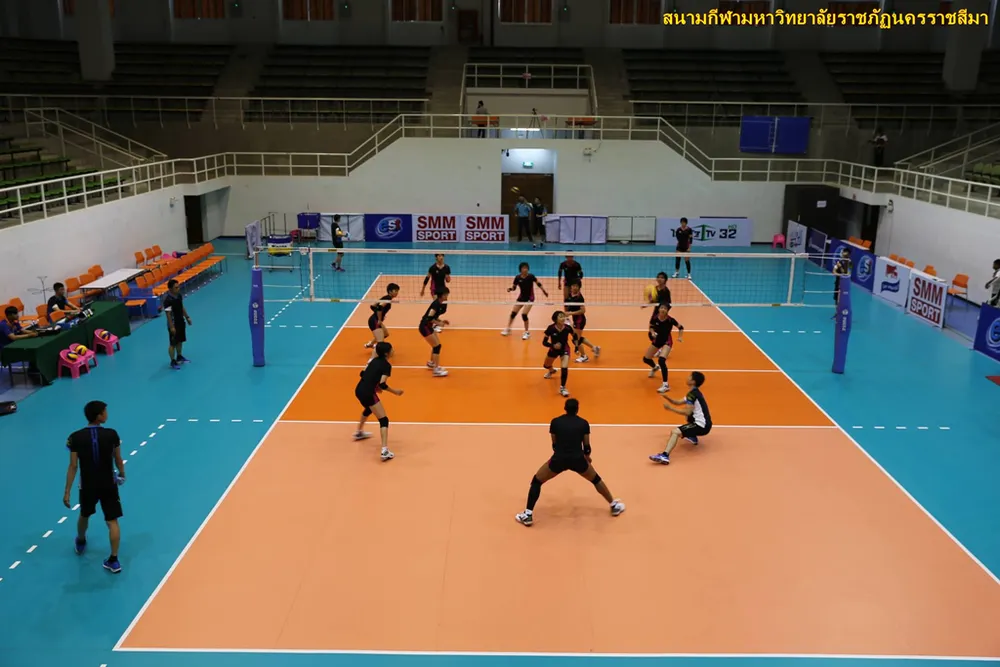 A volleyball match underway at a gymnasium in Thailand